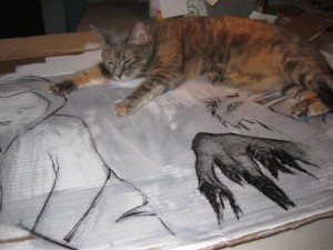 Frida taking a nap on my art.